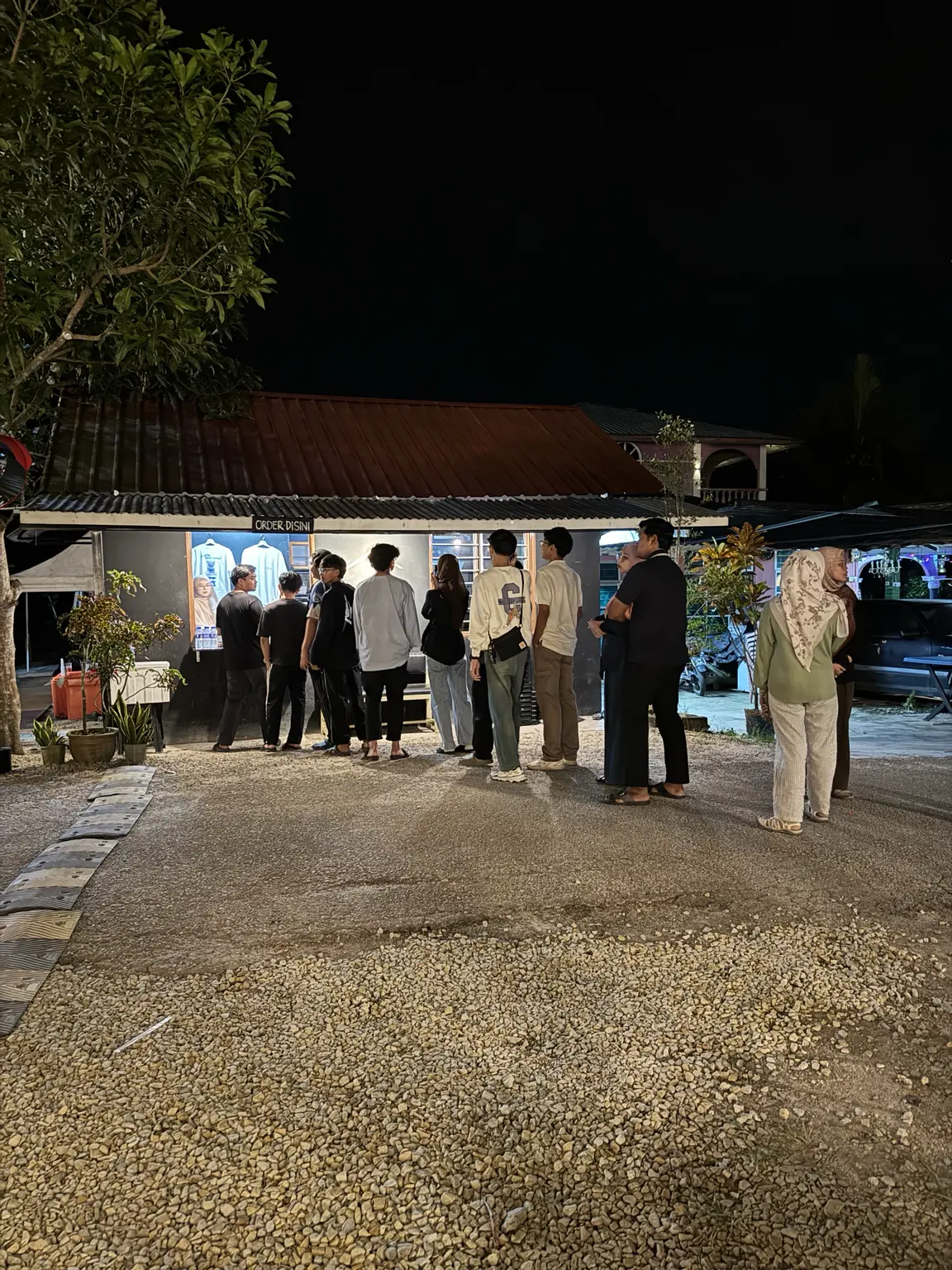 A small group gathered at the counter on a quiet night
