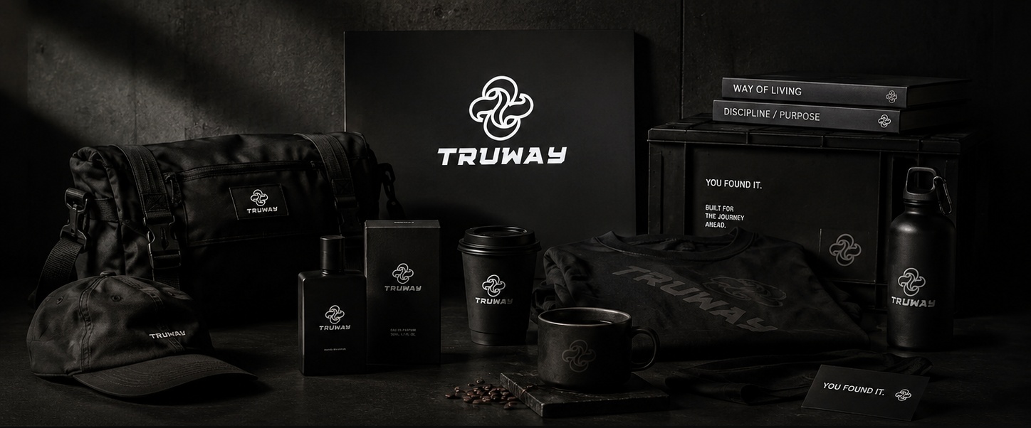 Dark TRUWAY still life with bag, cap, fragrance, coffee cup, tee and bottle under a branded emblem