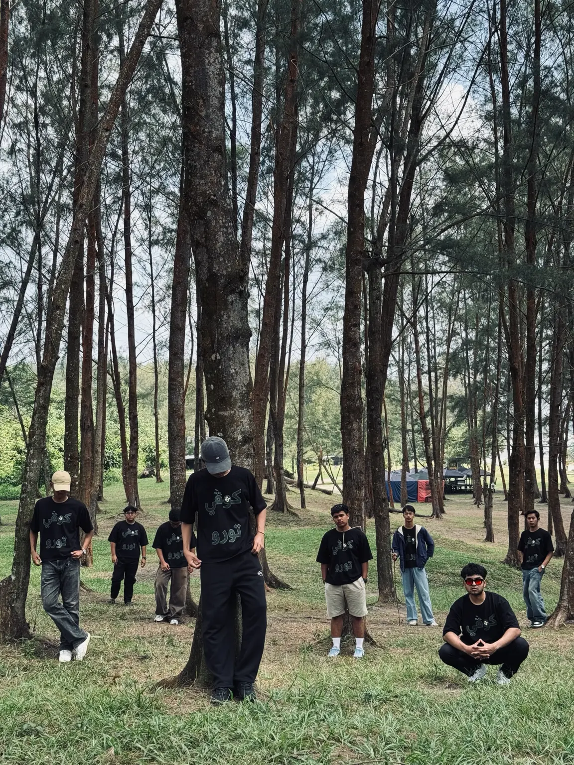 Group in the pine forest camp